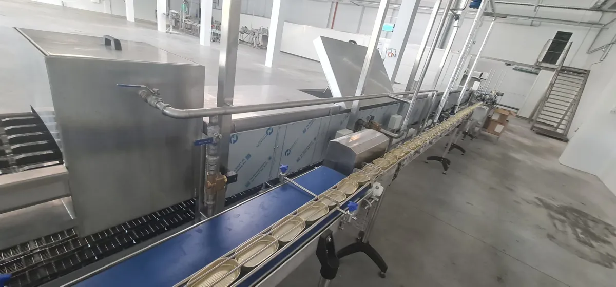 Fish fillet blanching and canned fish packing line